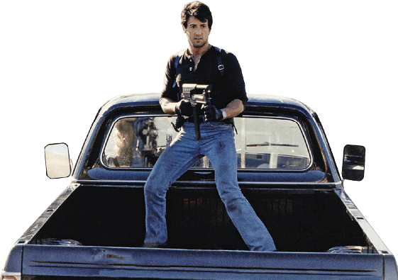 Stallone standing in the trunk of a truck from the movie Cobra