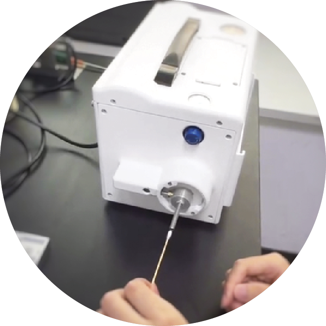 A machine scanning a ear bud
