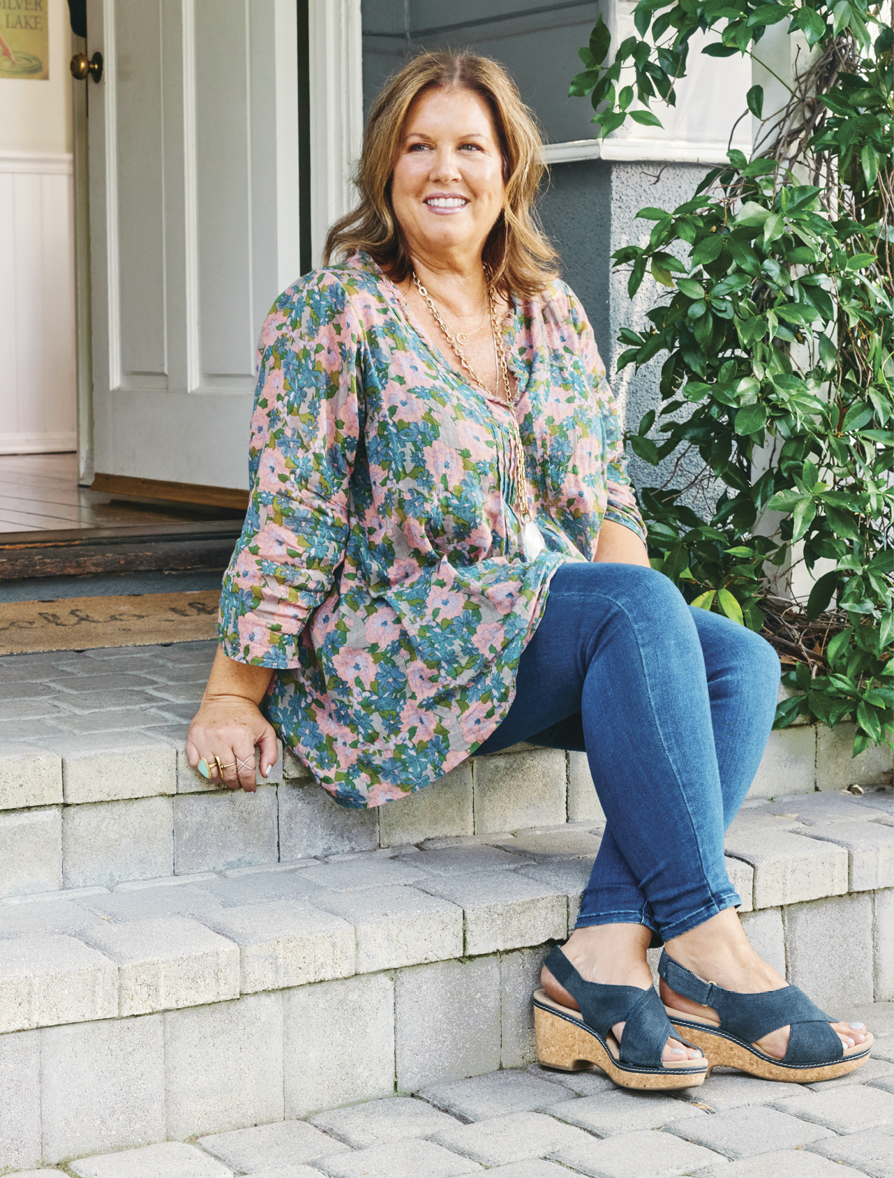 Image of McKeon sitting on the front porch of a house