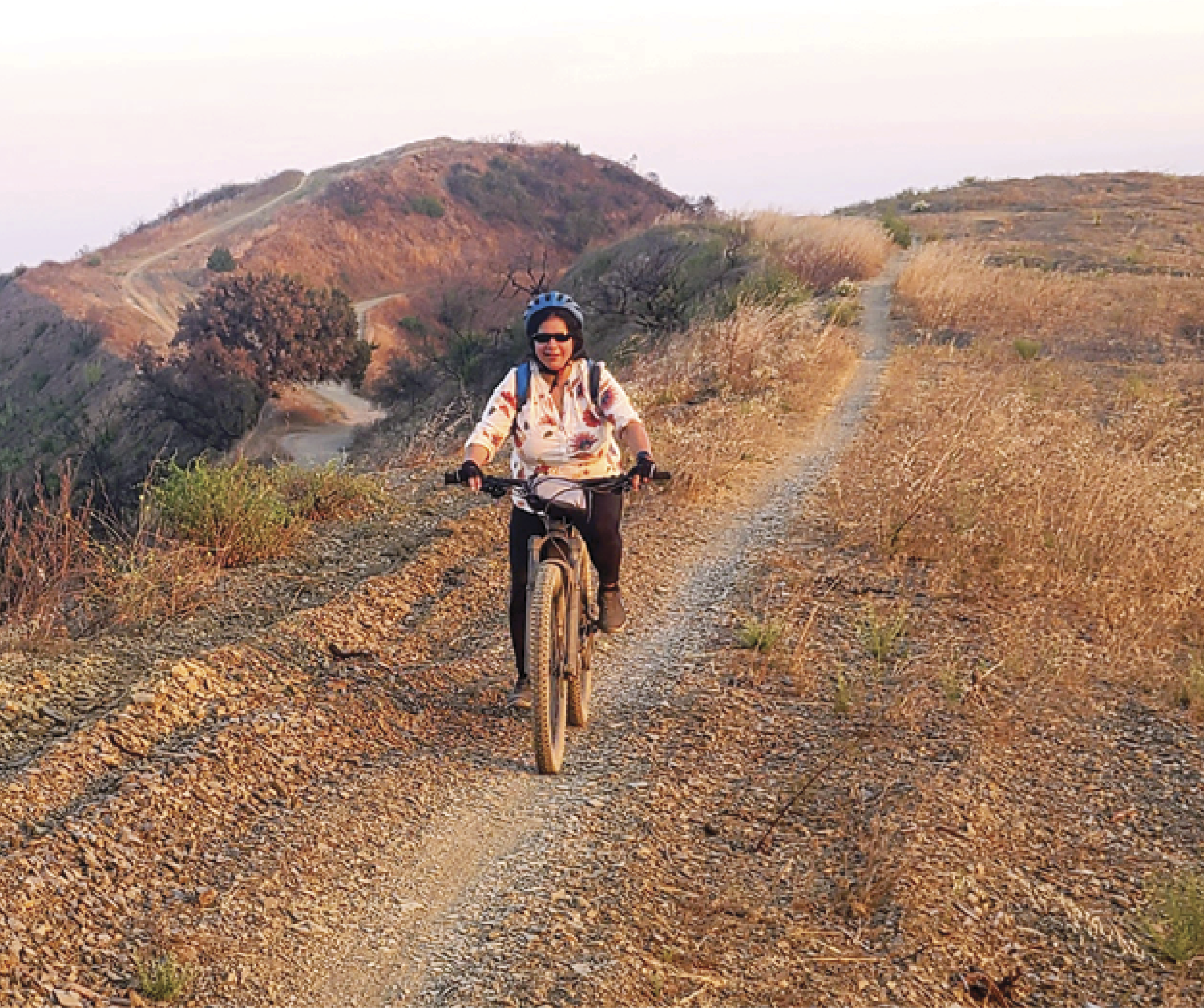 Damini Dey riding a cycle on the mountains of LA