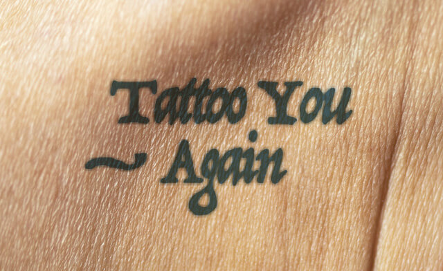 Photograph of someone's skin with the words Tattoo You- Again tattooed on it