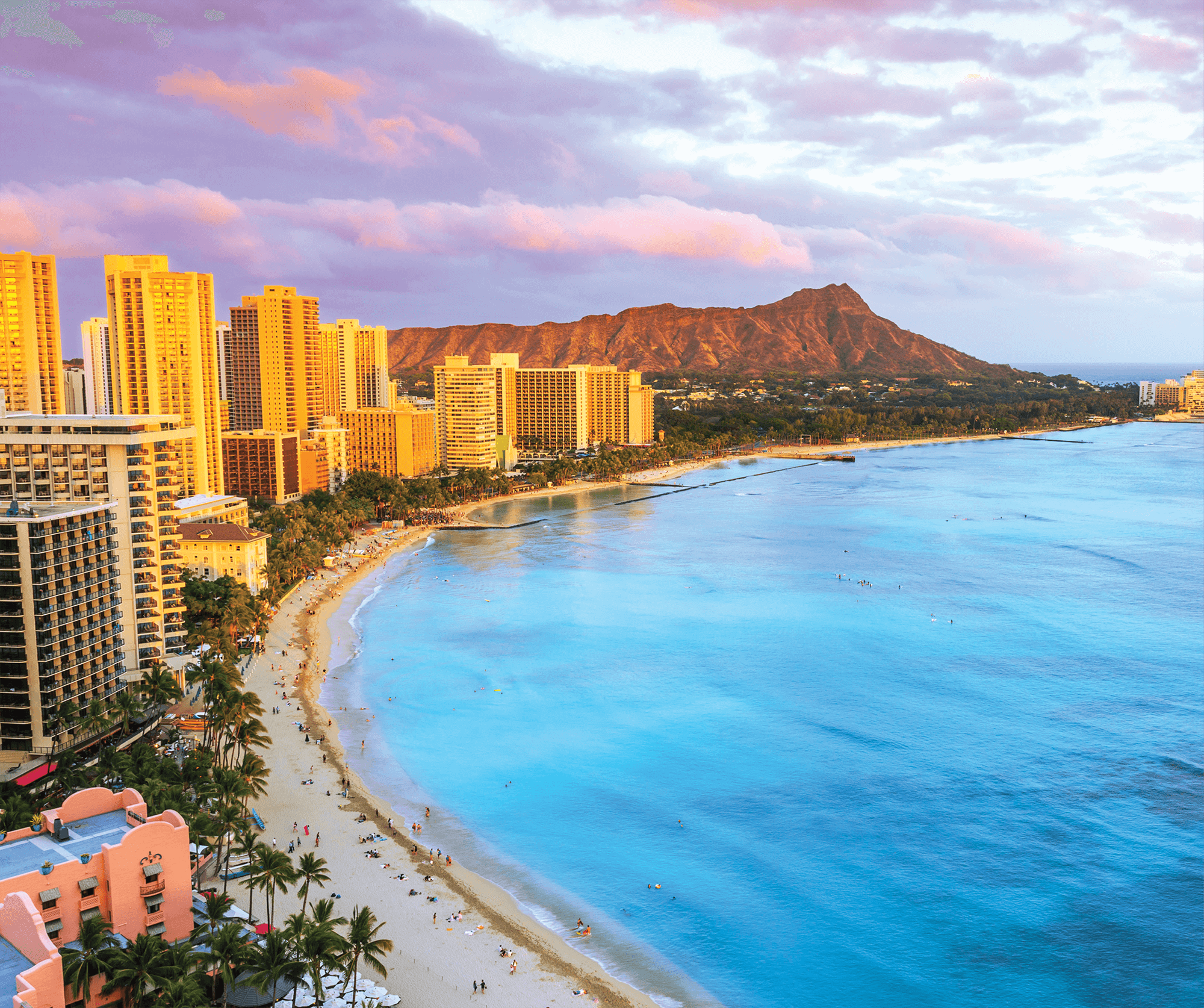 A scenic picture of the shoreline of Honolulu's Waikīkī Beach and Diamond Head volcano