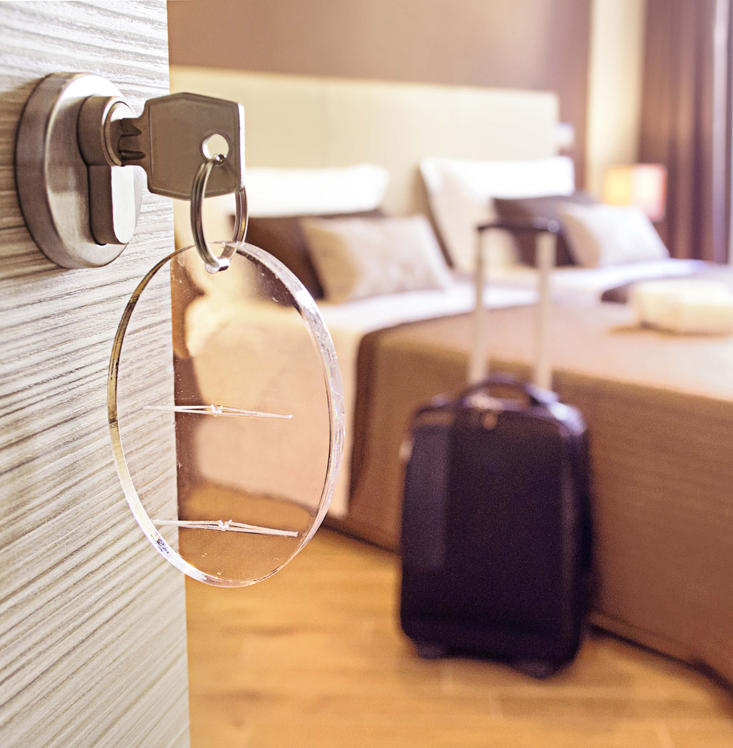 Photo of a key in a hotel room door