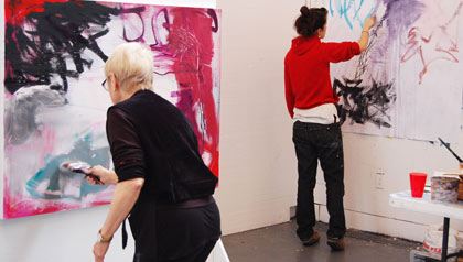 Expressive Drawing-two students work on their art projects in a studio