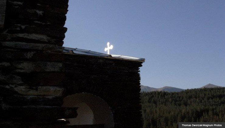Heaven on earth- A crucifix glints on the top of a church in Georgia 	