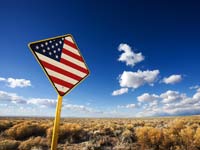 Chasing the American Dream - Road sign with American Flag on it