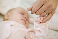 grandparents guide to childproofing holding baby finger