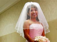 Rates of marriage and divorce differ by state- a young bride dressed in a pink gown is to be married on Valentine’s Day