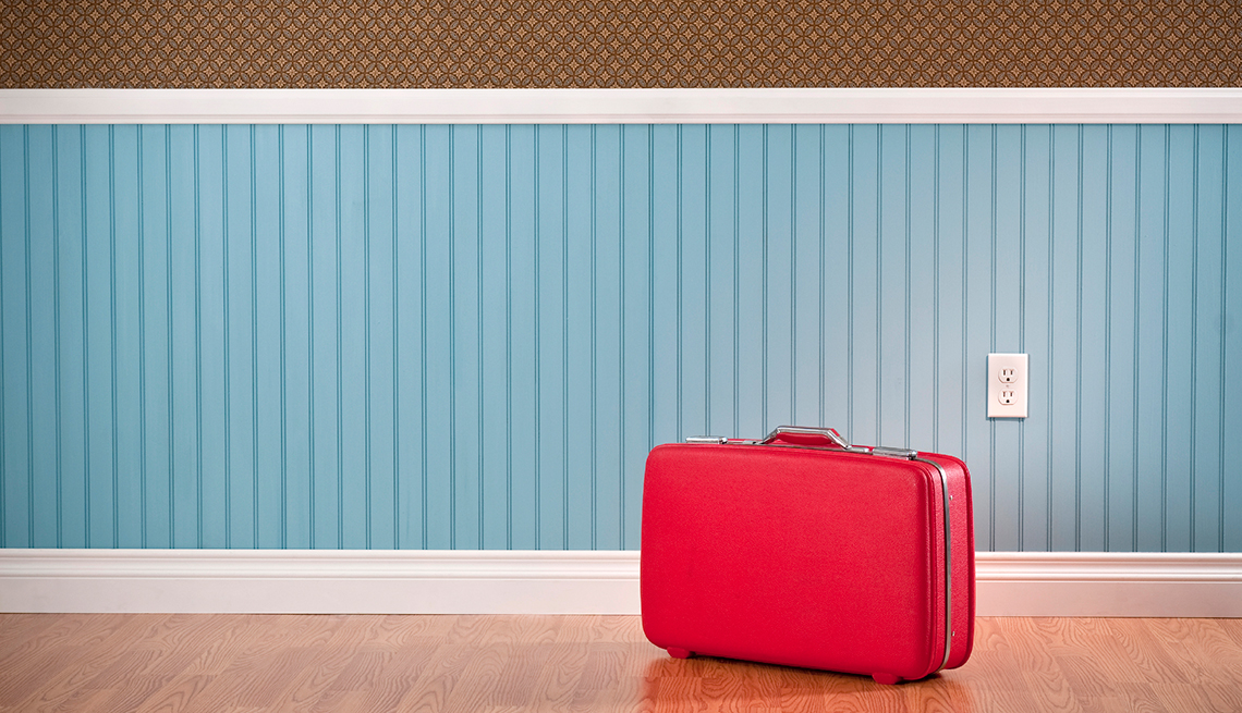 Red suitcase, blue and brown wall, Life and Leisure, AARP Research, Topics and Issues