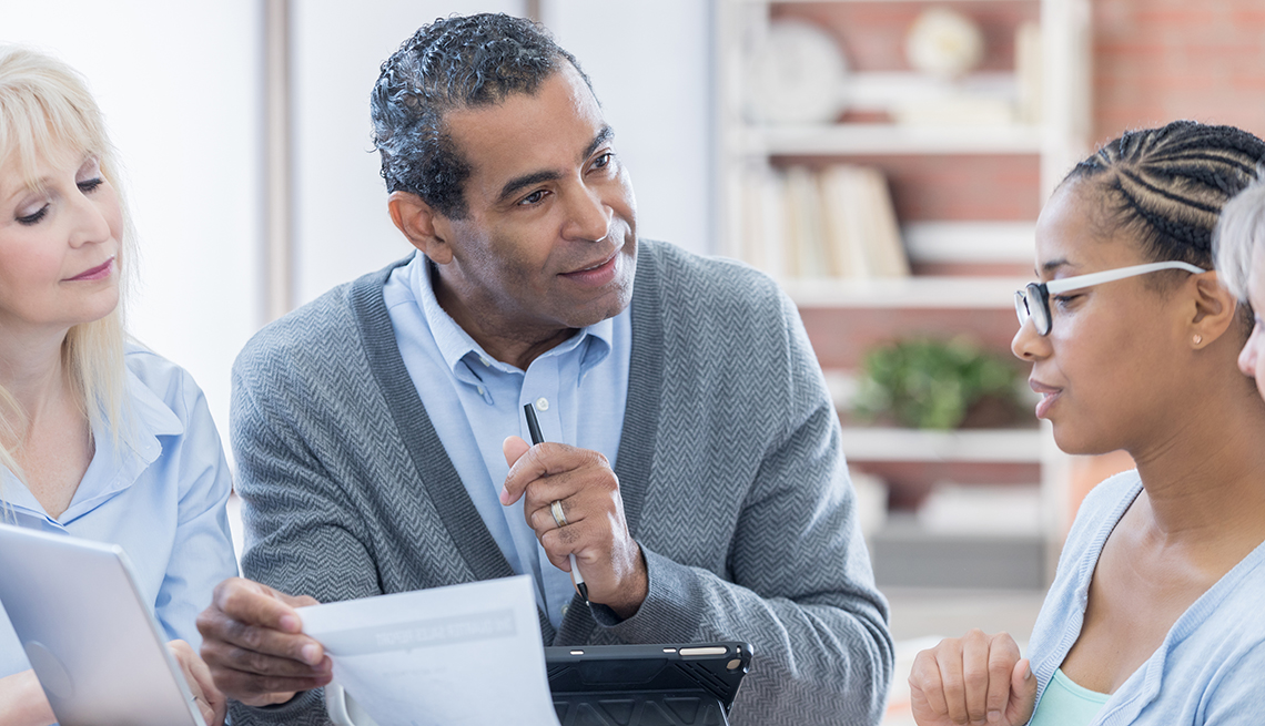 Middle Aged Man Consulting Two Women, AARP Research, Retirement Campaign Survey