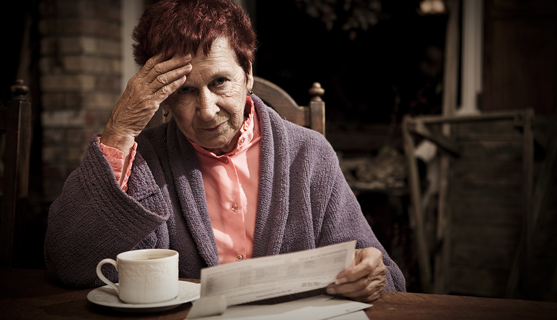 Older Woman Reviewing Bills