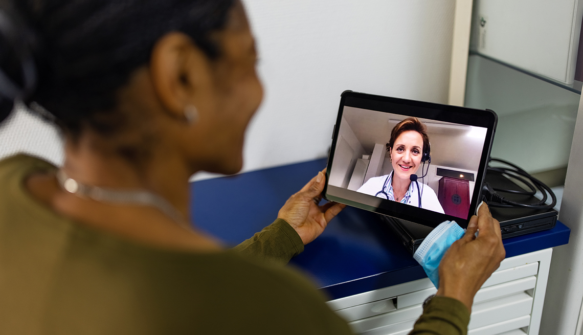 Woman Having Video Visit with Doctor via Tablet