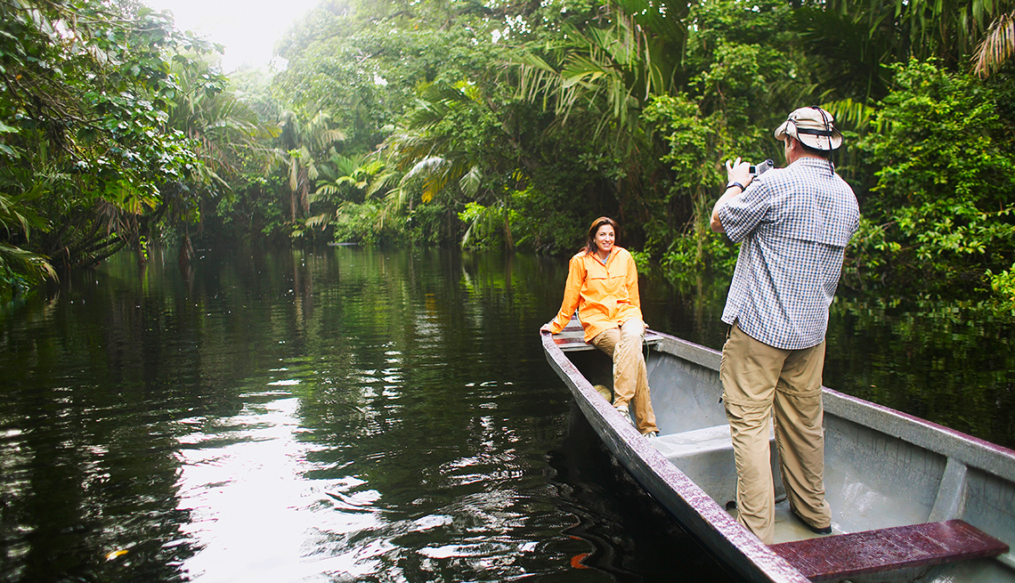 Woman sitting on boat edge in Costa Rica