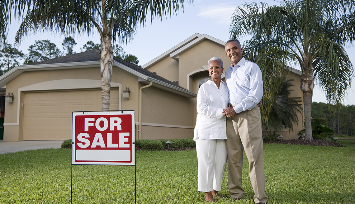 Mature couple selling large house to downsize
