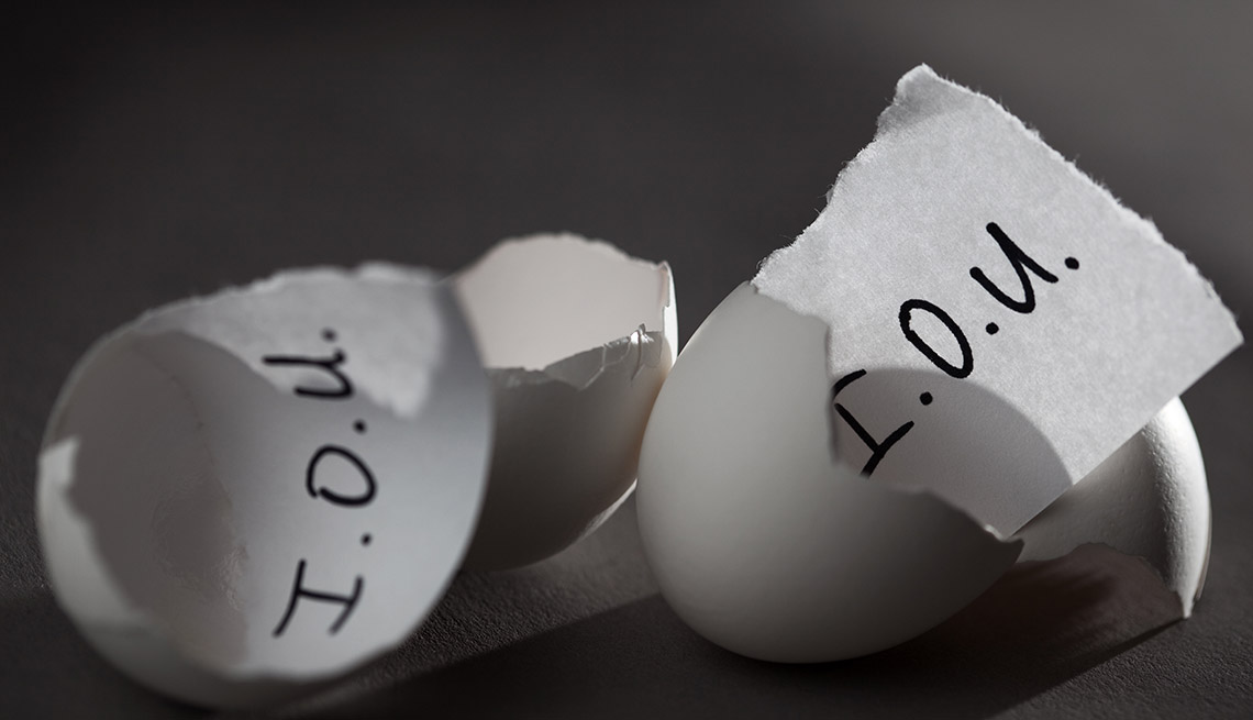 I.O.U. notes in cracked open eggs implying borrowing money from your retirement accounts