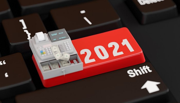 illustrated computer keyboard shift key pointing to 2021 with an open cash register of money