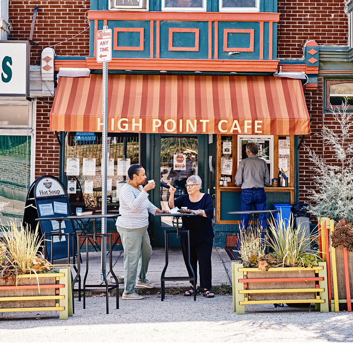 two people talk outside high point cafe in philadelphia pennsylvania