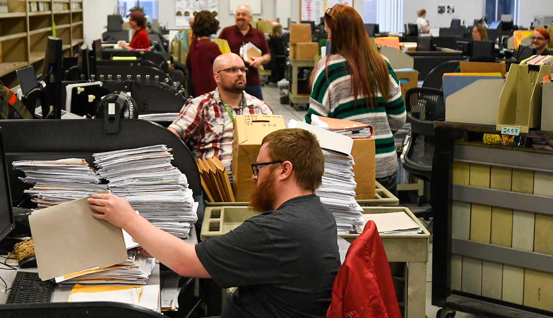 Tax Examiners working on a paper backlog at the Internal Revenue Service's facility on March 31, 2022 in Ogden, Utah.