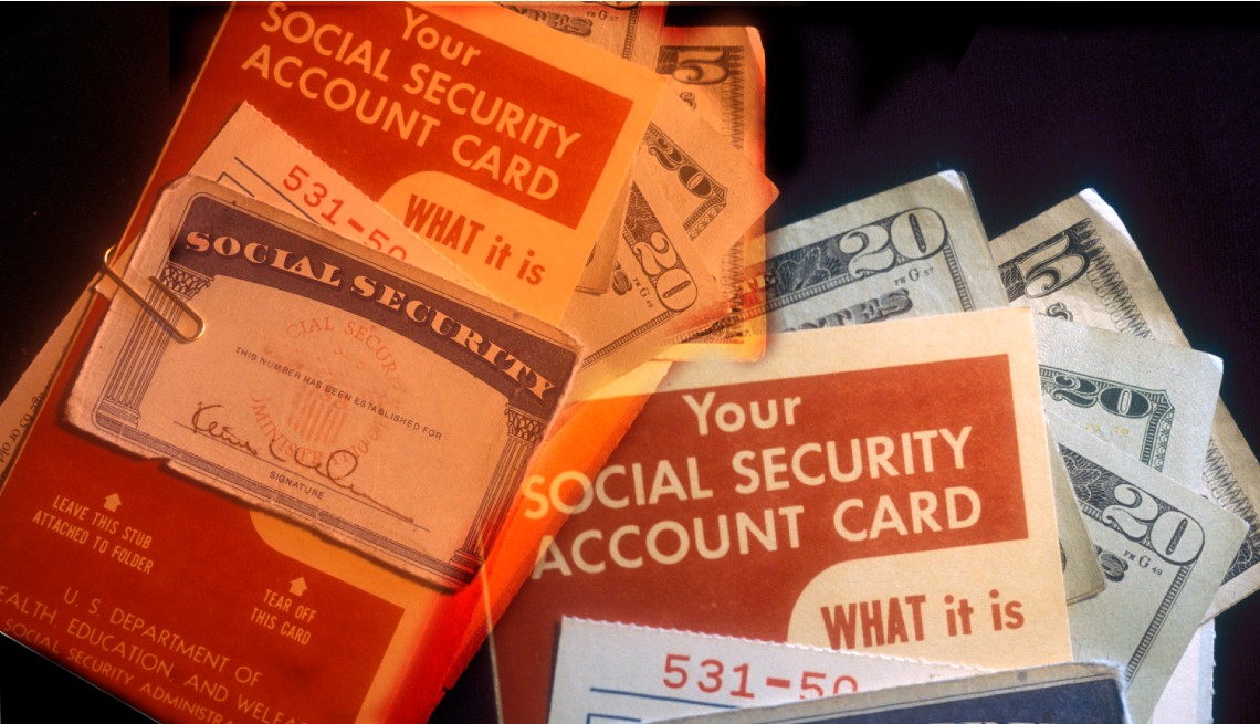 fanned out display of vintage social security brochures and cards with money
