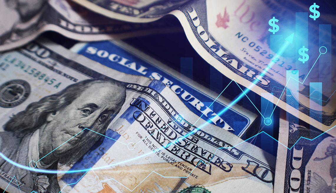 A social security card is partly covered by cash with a glowing blue indicator of dollar signs headed upwards