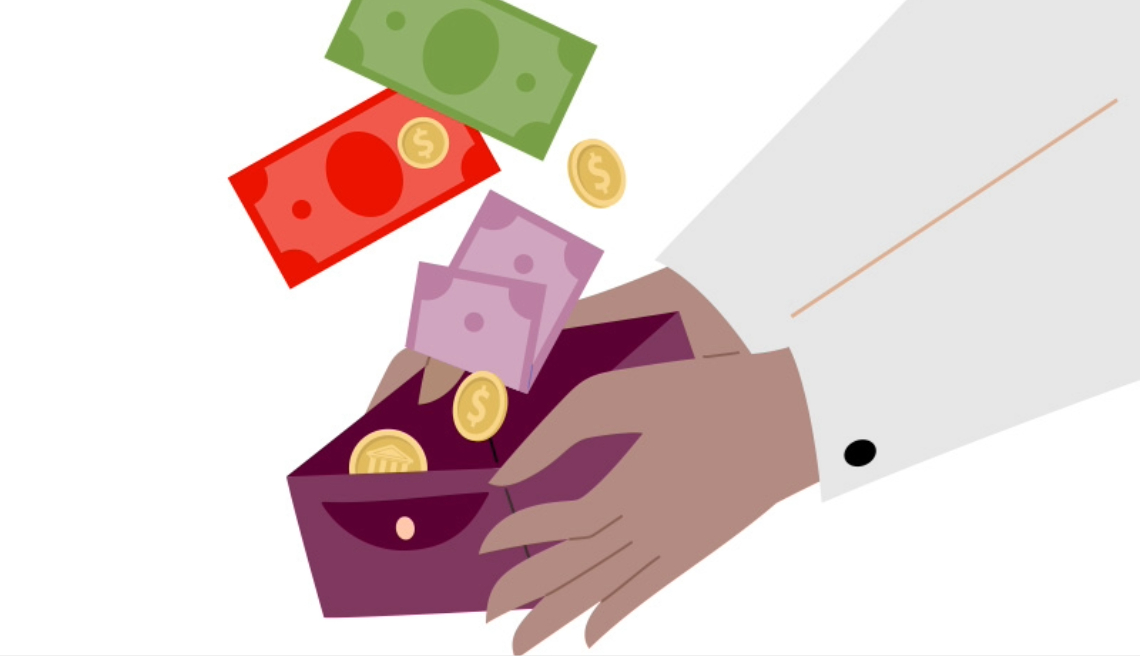 Holding a wallet with cash
