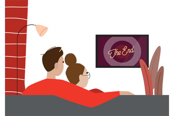 A couple on a sofa watching a movie