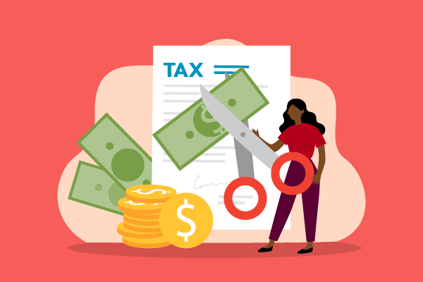 woman cutting tax documents