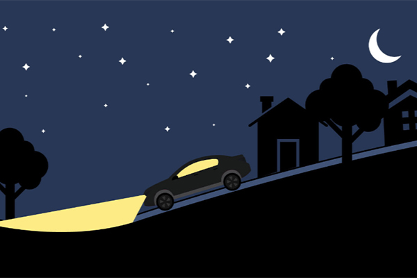 Illustration of car with headlights on driving down a hill at night
