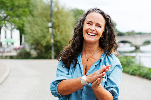 Woman looking confident walking near river