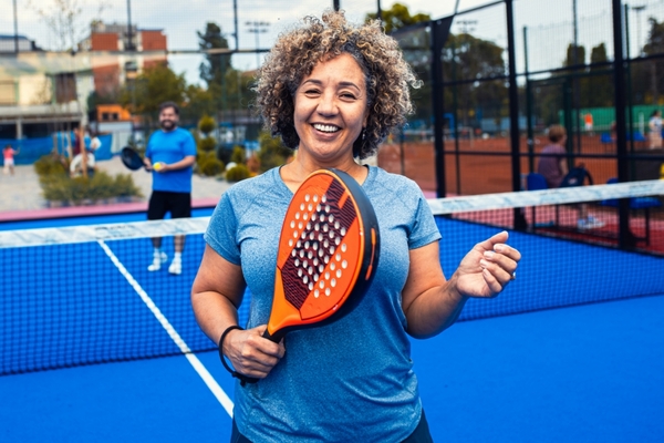 Woman Holding a Pickleball Paddle