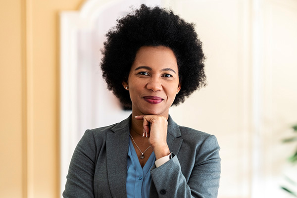 Woman wearing business clothes smiling