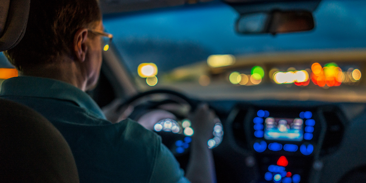 Person driving at night.