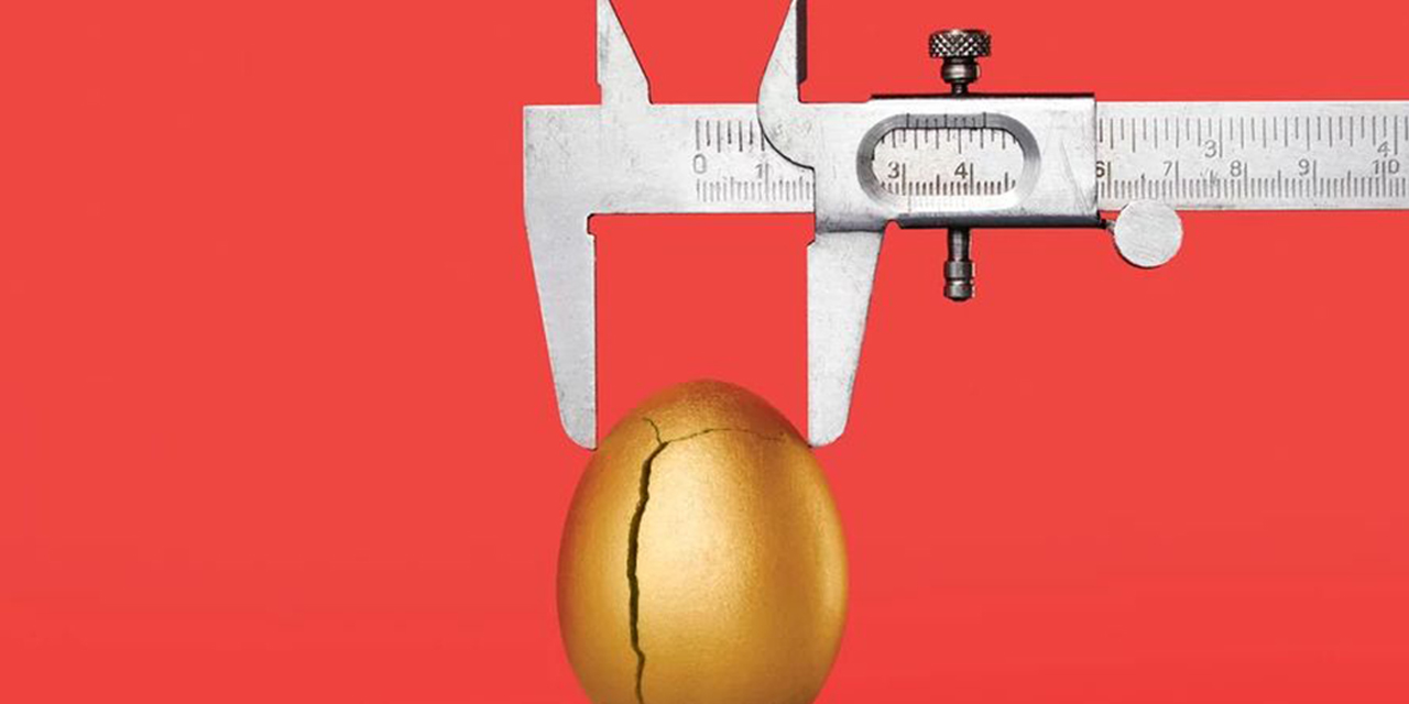 Golden egg being measured.