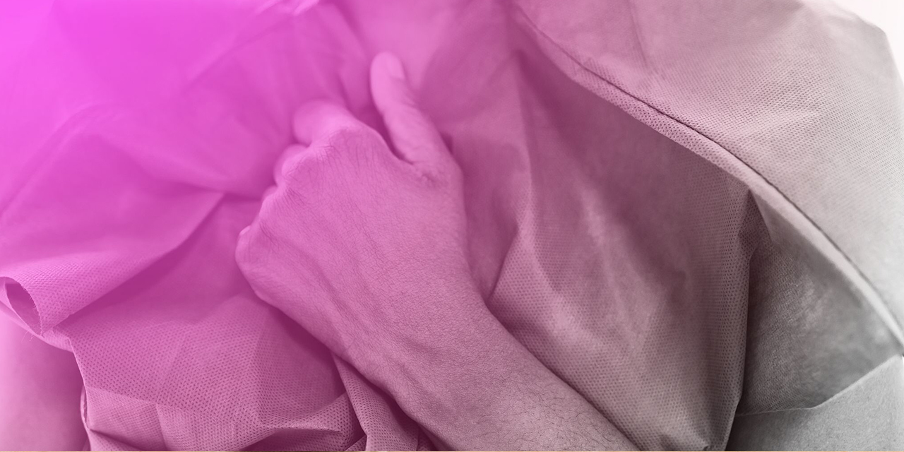 Person wearing a patient gown.