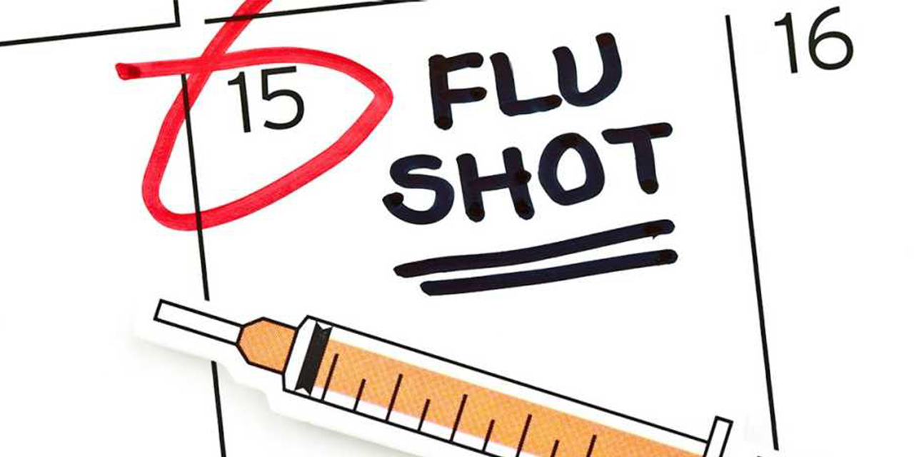 Flu shot labeled on a calendar.