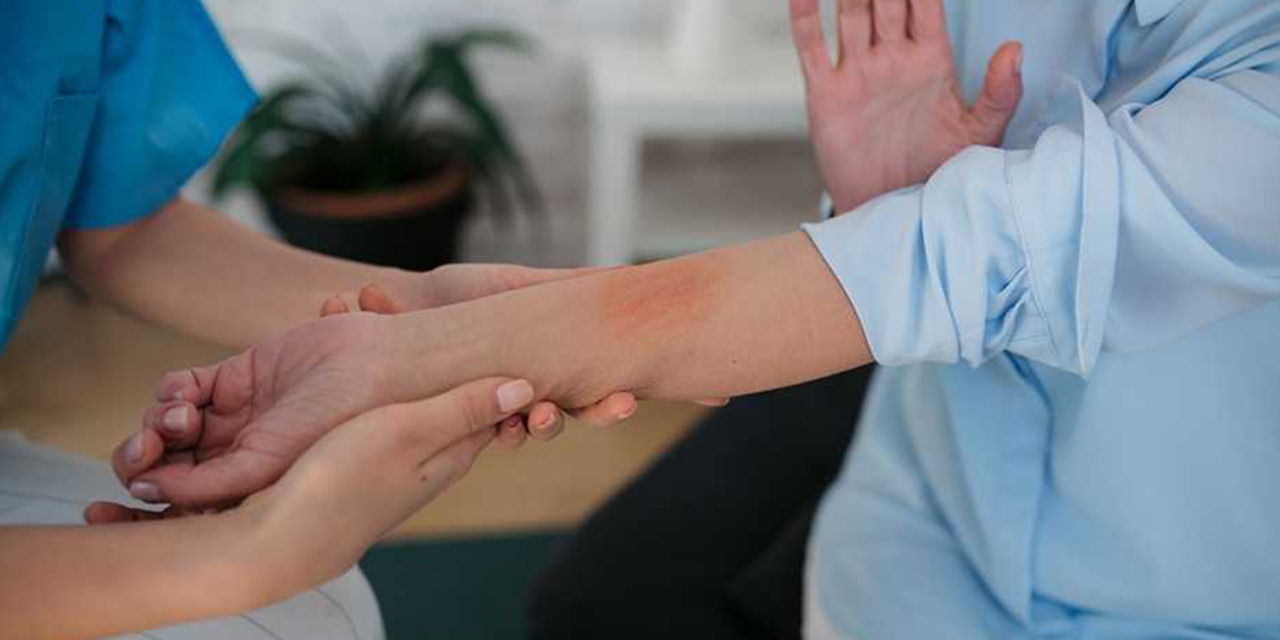 Person exhibiting a rash on their arm.
