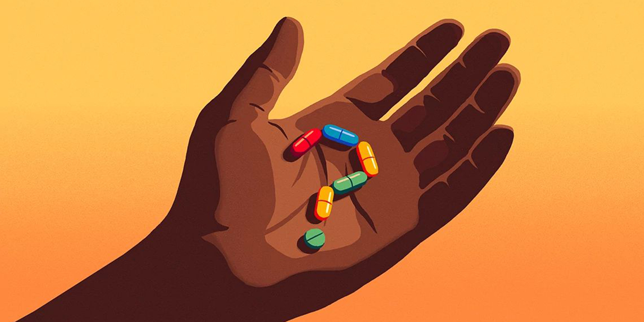 Person holding a variety of pills.