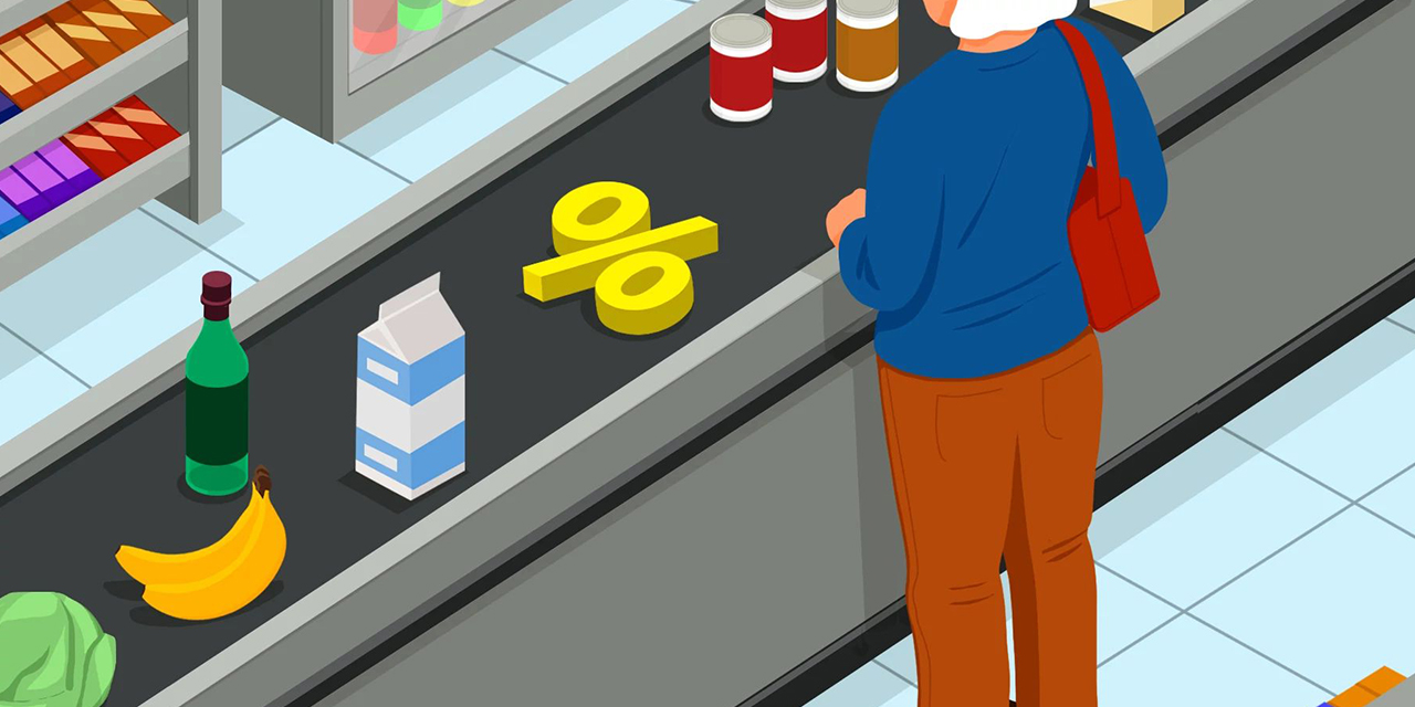 Person purchasing goods at a grocery store.