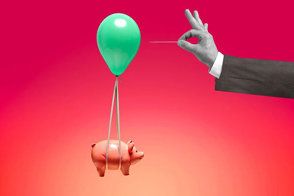 piggy bank buoyed by balloon about to be popped
