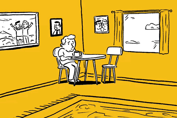 Person sitting at a table alone.