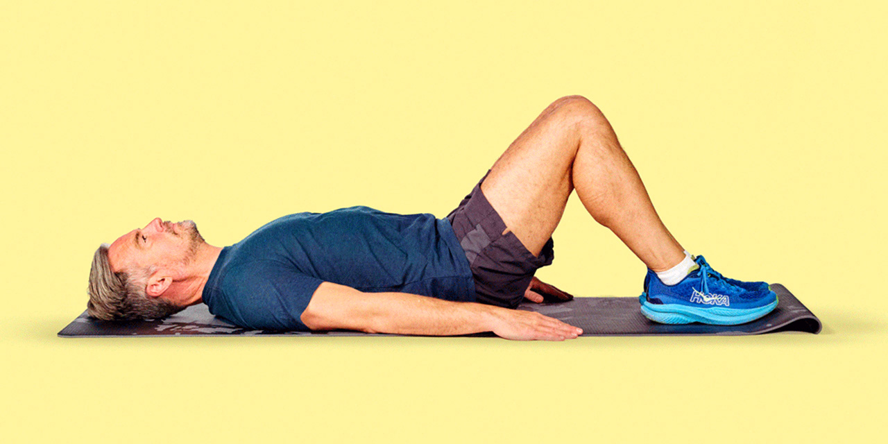 Person lying on exercise mat.