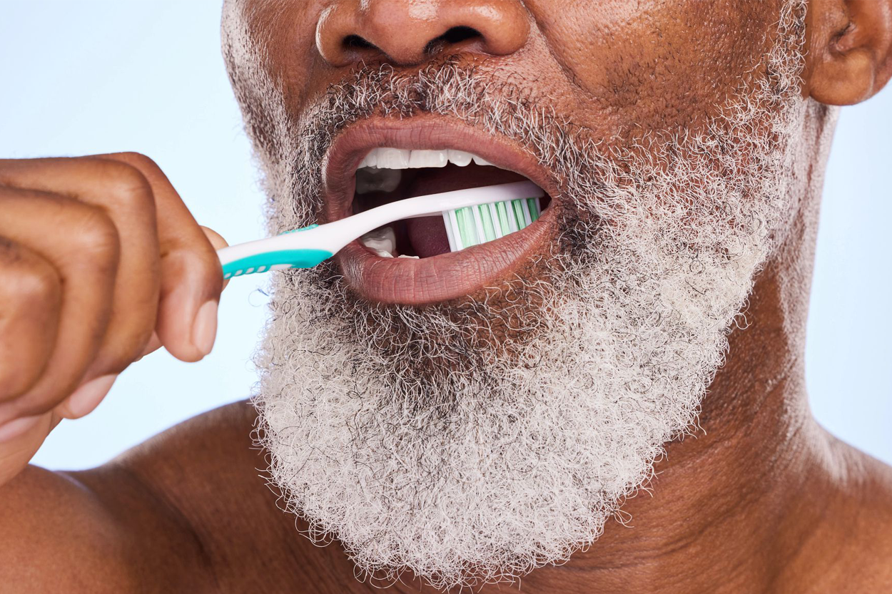 Person brushing teeth.