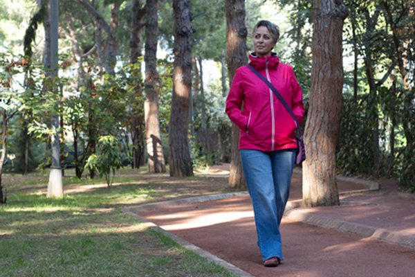 Person walking in a park.