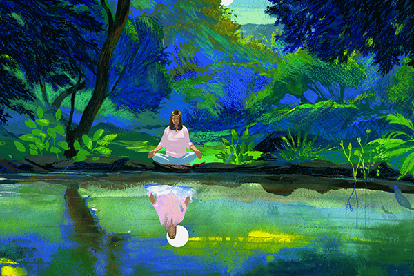Person sitting by a riverbank.