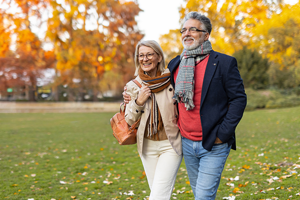 Couple walking in a park.
