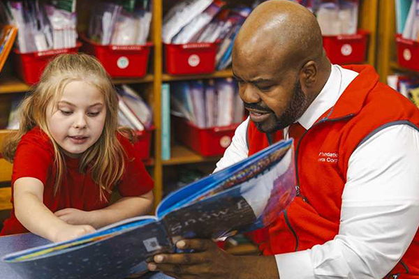 Volunteer tutors student.