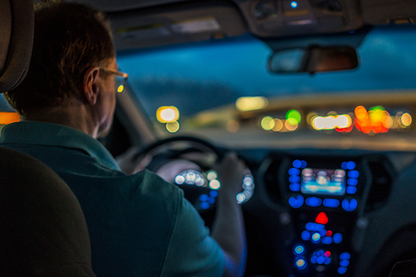 Person driving at night.