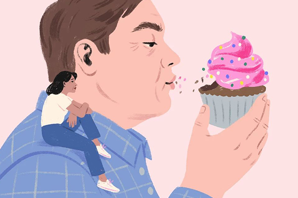 Person eating cupcake.