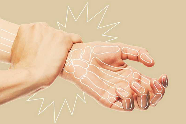 Person holding their wrist.