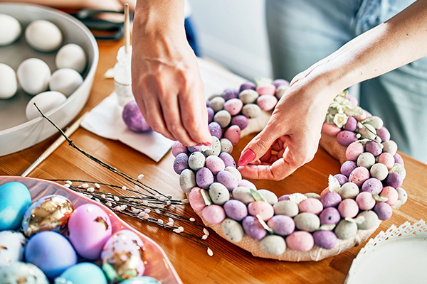 Person making an Easter wreath.